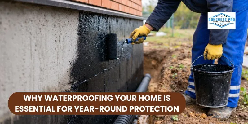 Worker applying waterproofing coating to house foundation wall to prevent water damage